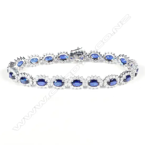 A platinum sapphire and diamond halo tennis bracelet