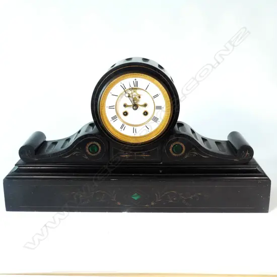 A large Victorian black marble clock
