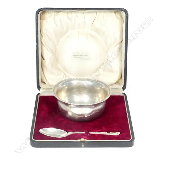 A silver bowl and spoon set