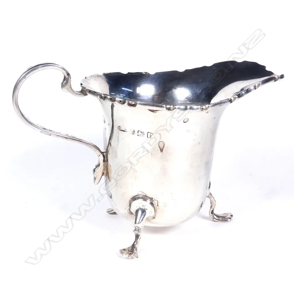 A silver cream jug Image 1++