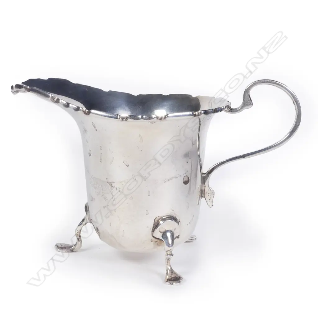 A silver cream jug Image 1++