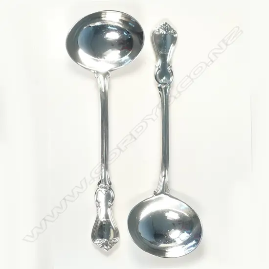 A pair of heavy double struck Victorian silver sauce ladles