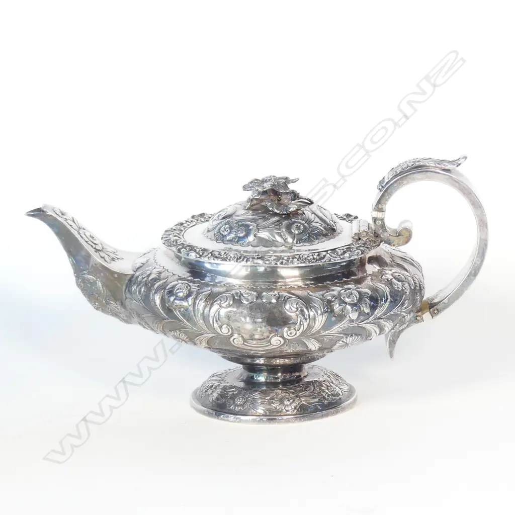 A George IV fancy embossed silver teapot Image 1++