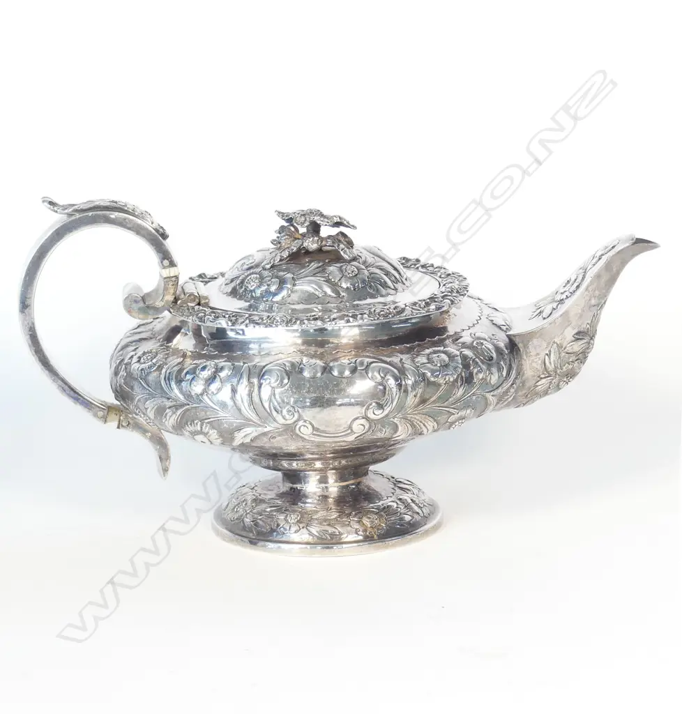A George IV fancy embossed silver teapot Image 1++
