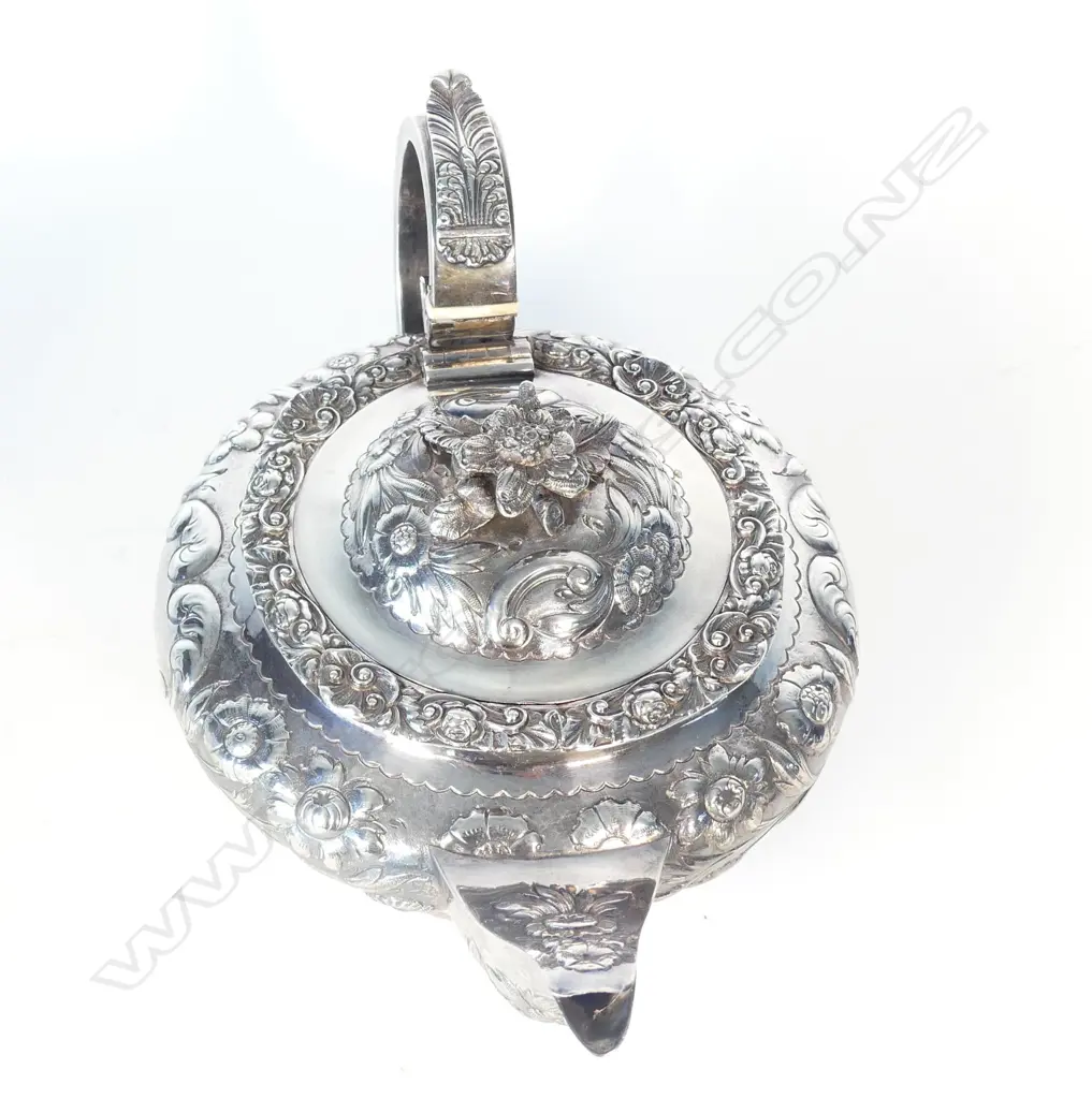A George IV fancy embossed silver teapot Image 1++