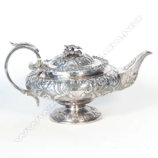 A George IV fancy embossed silver teapot