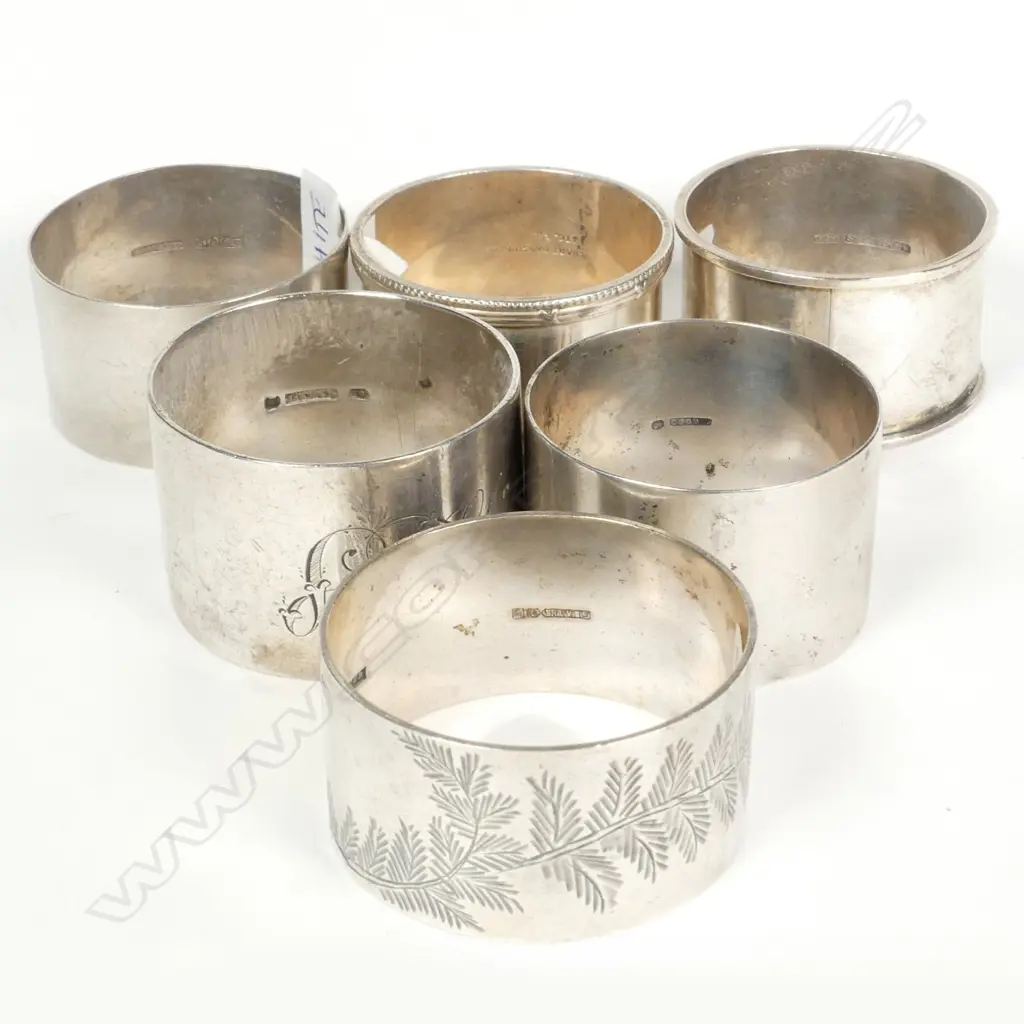 Six NZ silver napkin rings Image 1++