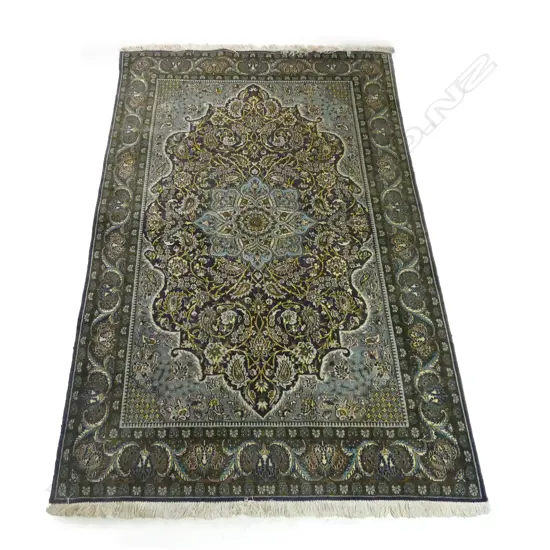A wool and cotton mix Qum rug