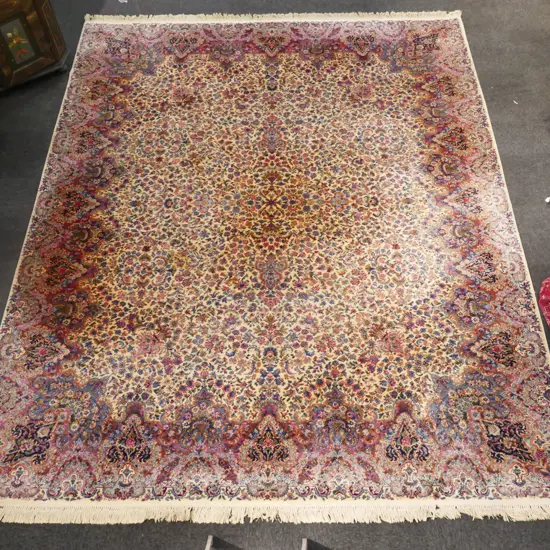 A very large Persian style machine knotted woollen carpet