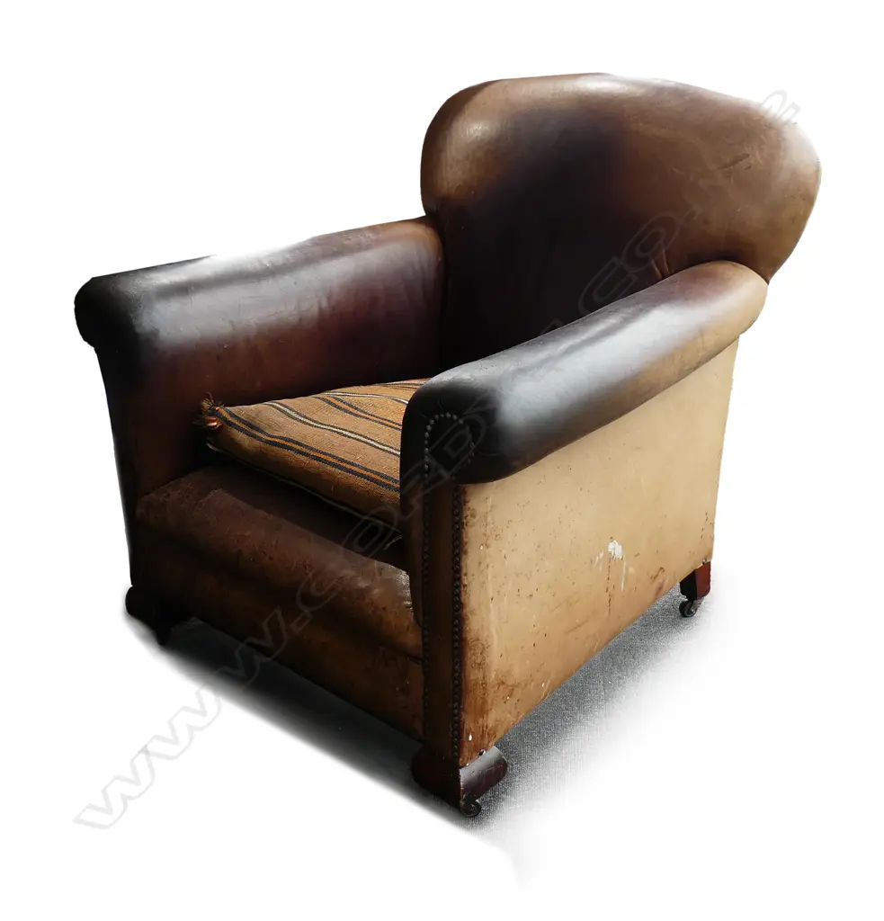 A vintage leather upholstered roll arm club-type chair Image 1++