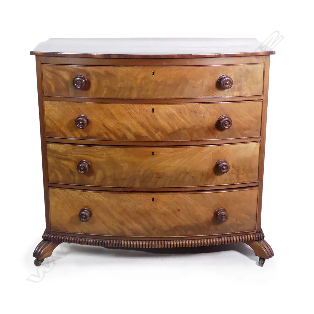 A Regency bow-front four-drawer chest Image 1++