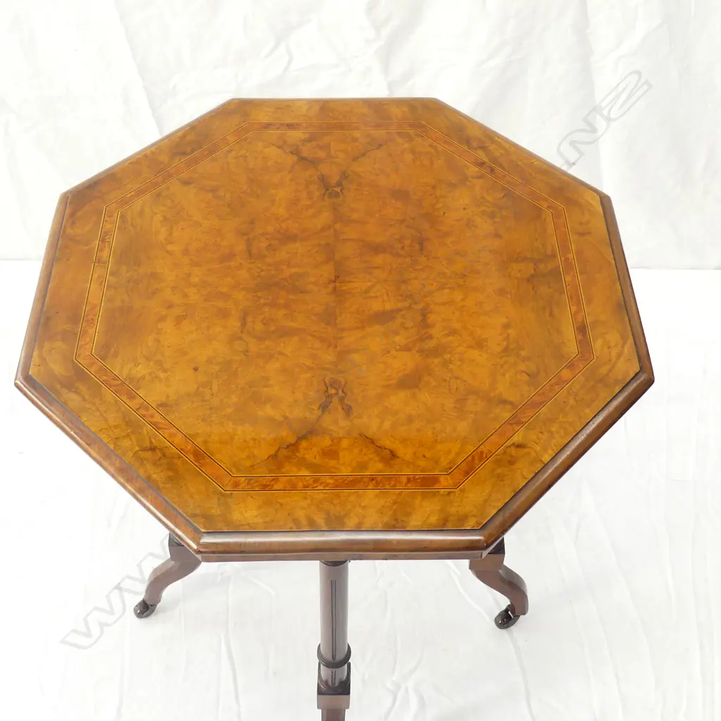 A Victorian figured walnut octagonal side table Image 1++
