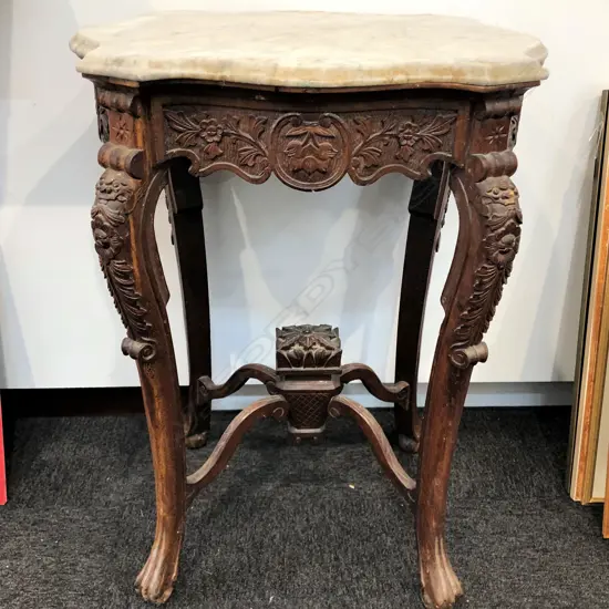 An old carved Chinese occasional table