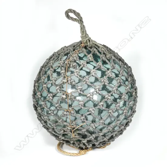An old glass large fishing net float