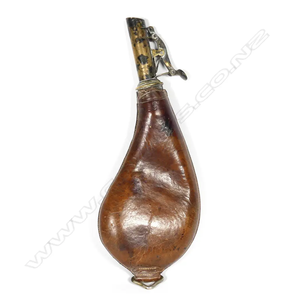 A kidney shaped leather shot flask Image 1++