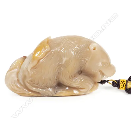 An uncommon large brown jadeite handling piece