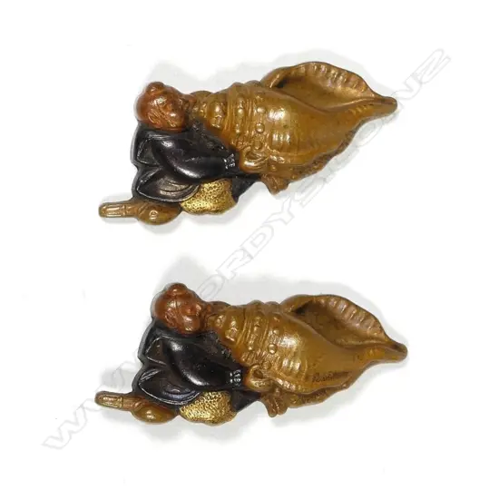 A pair of Japanese kana mono depicting samurai blowing massive conch trumpets