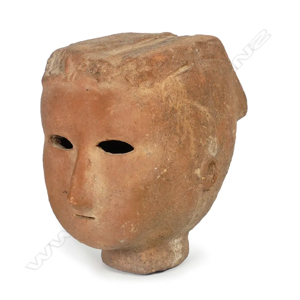A Japanese Kofun period (5th - 6thC) Haniwa terracotta head of a female Image 1++