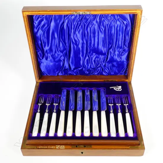 An Edwardian twelve place silver and mother of pearl fruit set