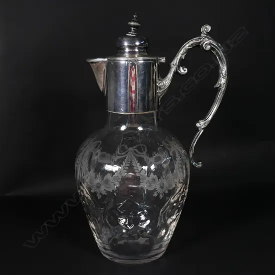 An Edwardian crystal and silver plate claret jug