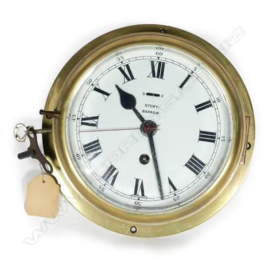 A ship's brass bulkhead clock