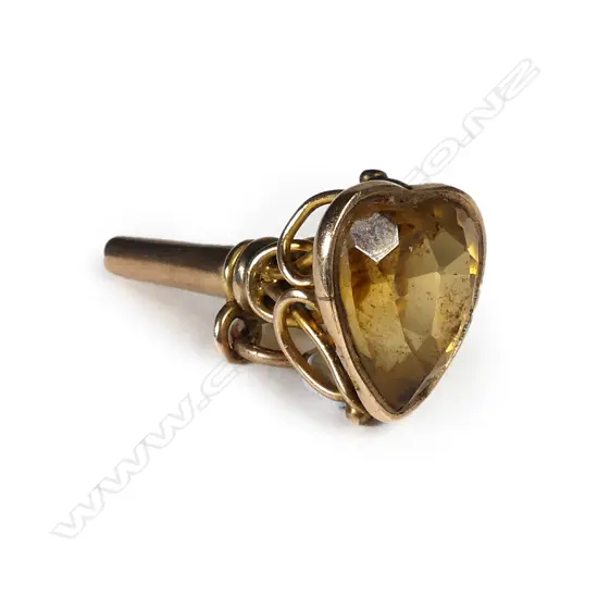 A 9ct gold watch key