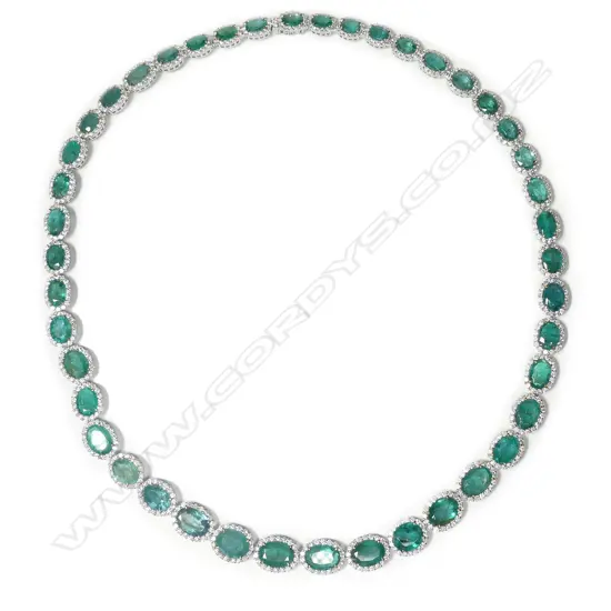 An impressive platinum emerald and diamond necklace