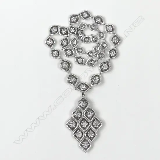 An impressive 18ct. gold white gold and multi-diamond pendant necklace