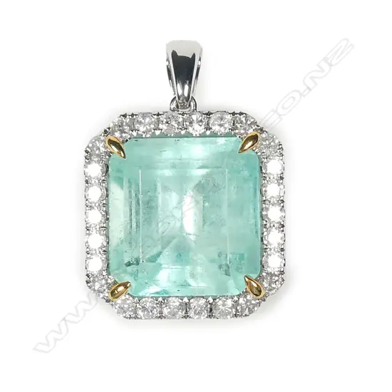 A platinum emerald and diamond pendant