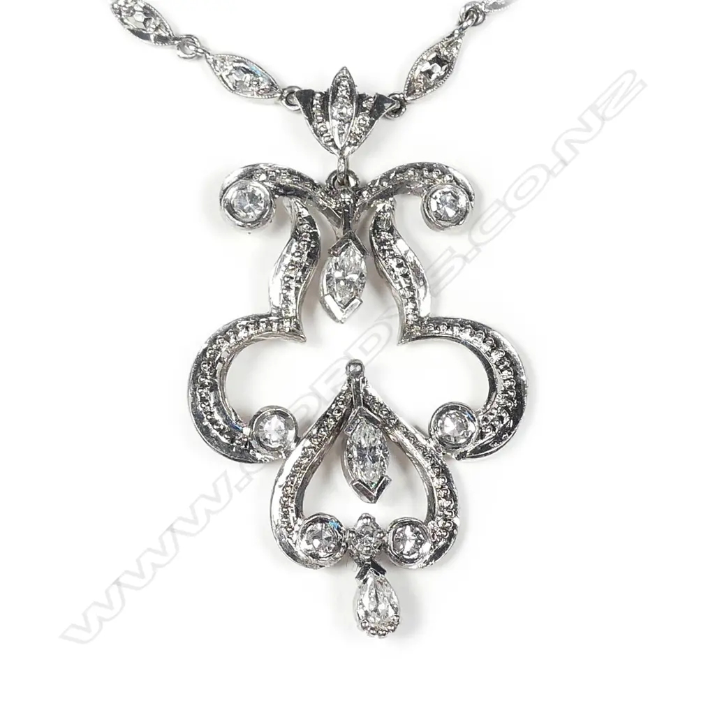 A 9ct white gold diamond set necklace Image 1++