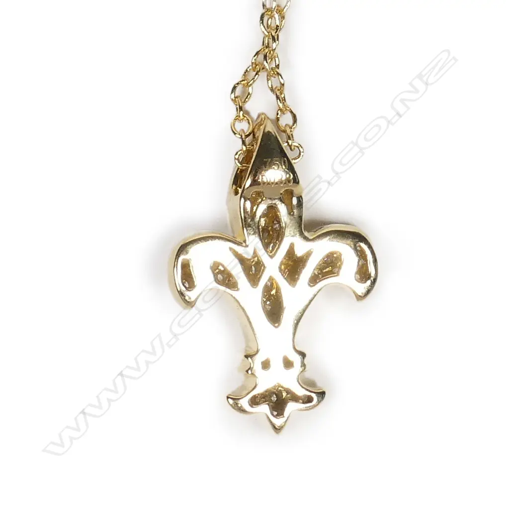 A modern 18ct. yellow gold and diamond set fleur-de-lis pendant on chain Image 1++
