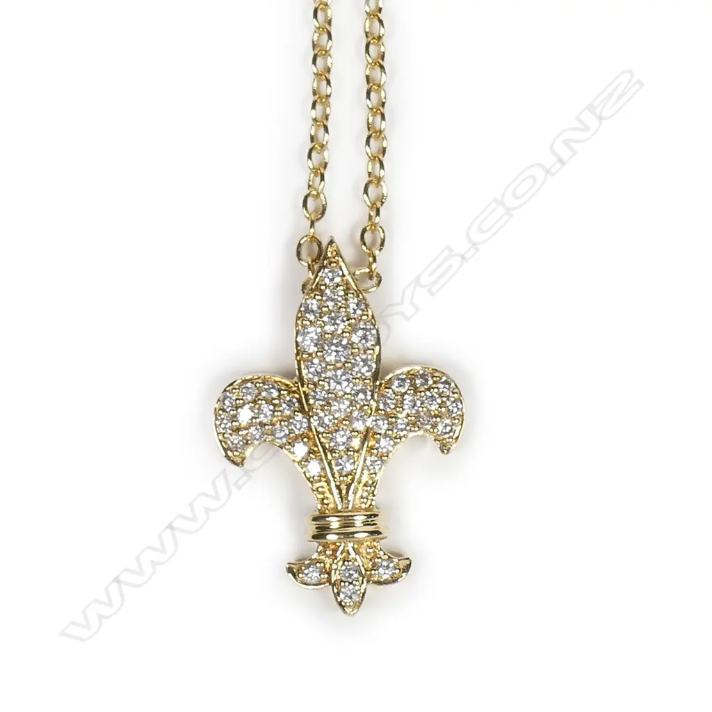 A modern 18ct. yellow gold and diamond set fleur-de-lis pendant on chain Image 1++