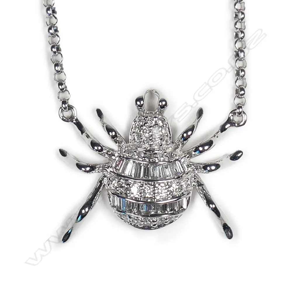 A modern 18ct. white gold and diamond set spider on chain Image 1++