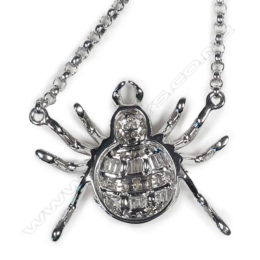 A modern 18ct. white gold and diamond set spider on chain Image 1++