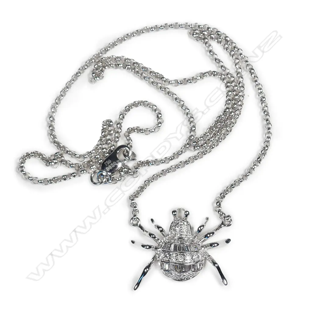 A modern 18ct. white gold and diamond set spider on chain Image 1++