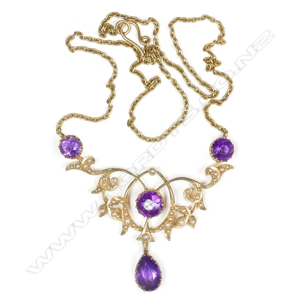 A c.1890 Victorian 15ct yellow gold amethyst and seed pearl scrolling pendant on chain Image 1++