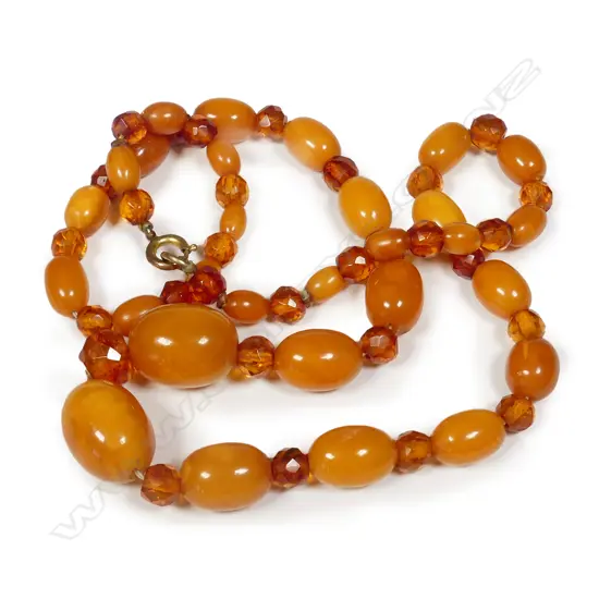 A vintage strand of graduated amber and faceted glass beads