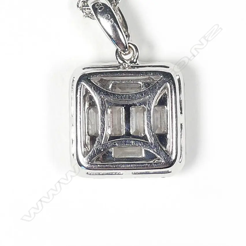 An 18ct. white gold and diamond pendant on chain Image 1++
