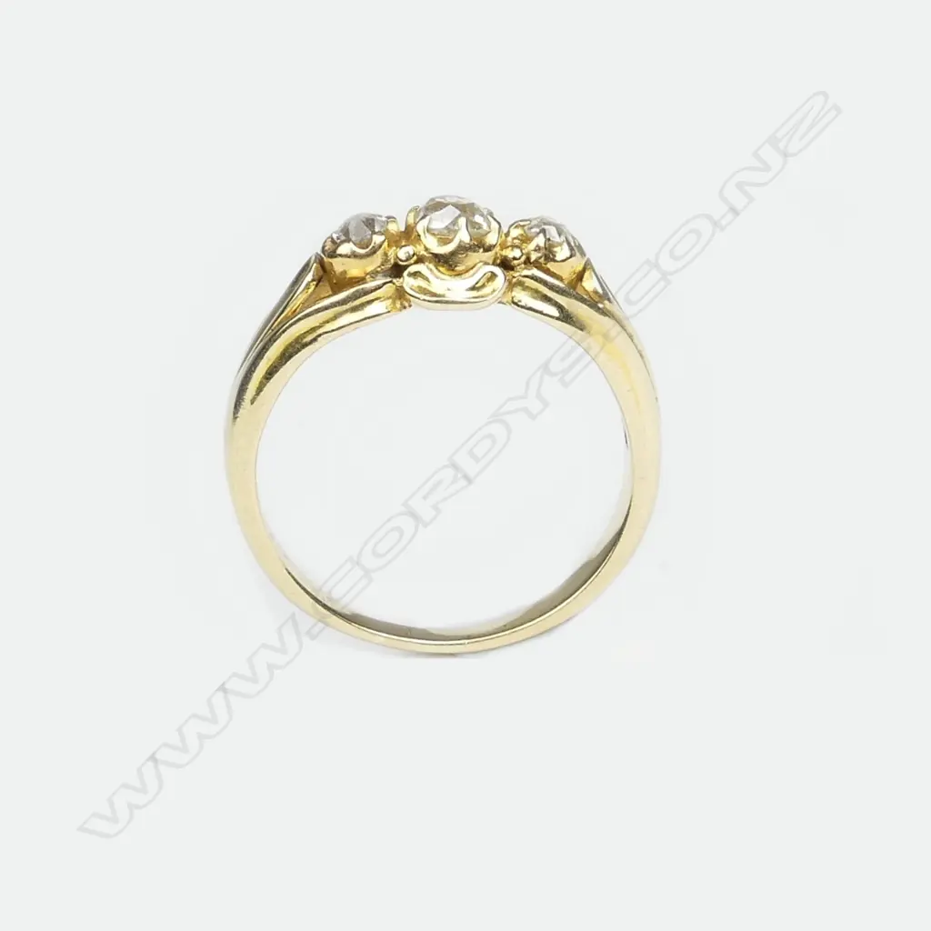 An estate 18ct. yellow gold handmade three diamond dress ring Image 1++