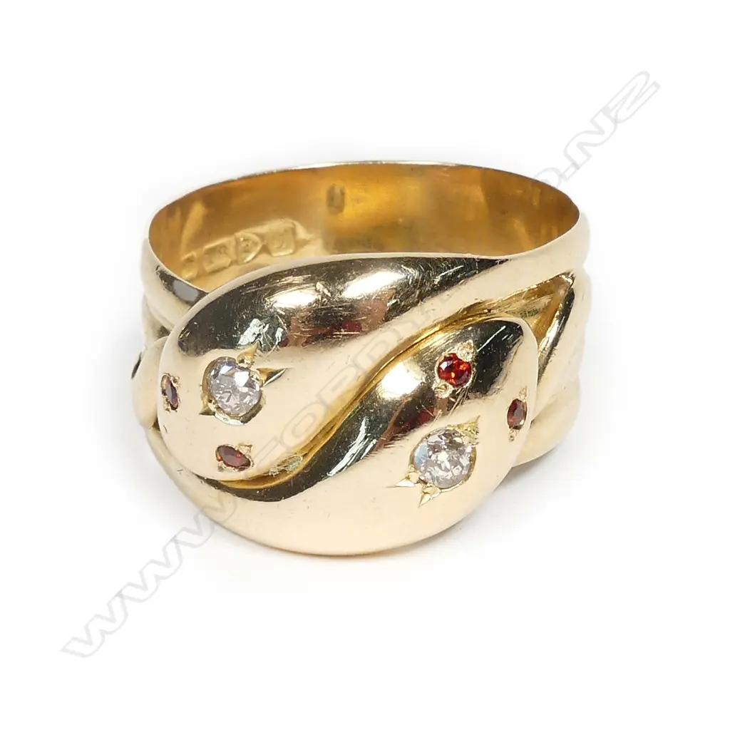 An early 1900s 18ct gold diamond and garnet snake ring Image 1++