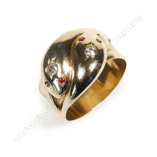 An early 1900s 18ct gold diamond and garnet snake ring