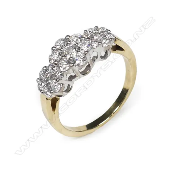 An 18ct yellow and white gold triple cluster diamond set ring