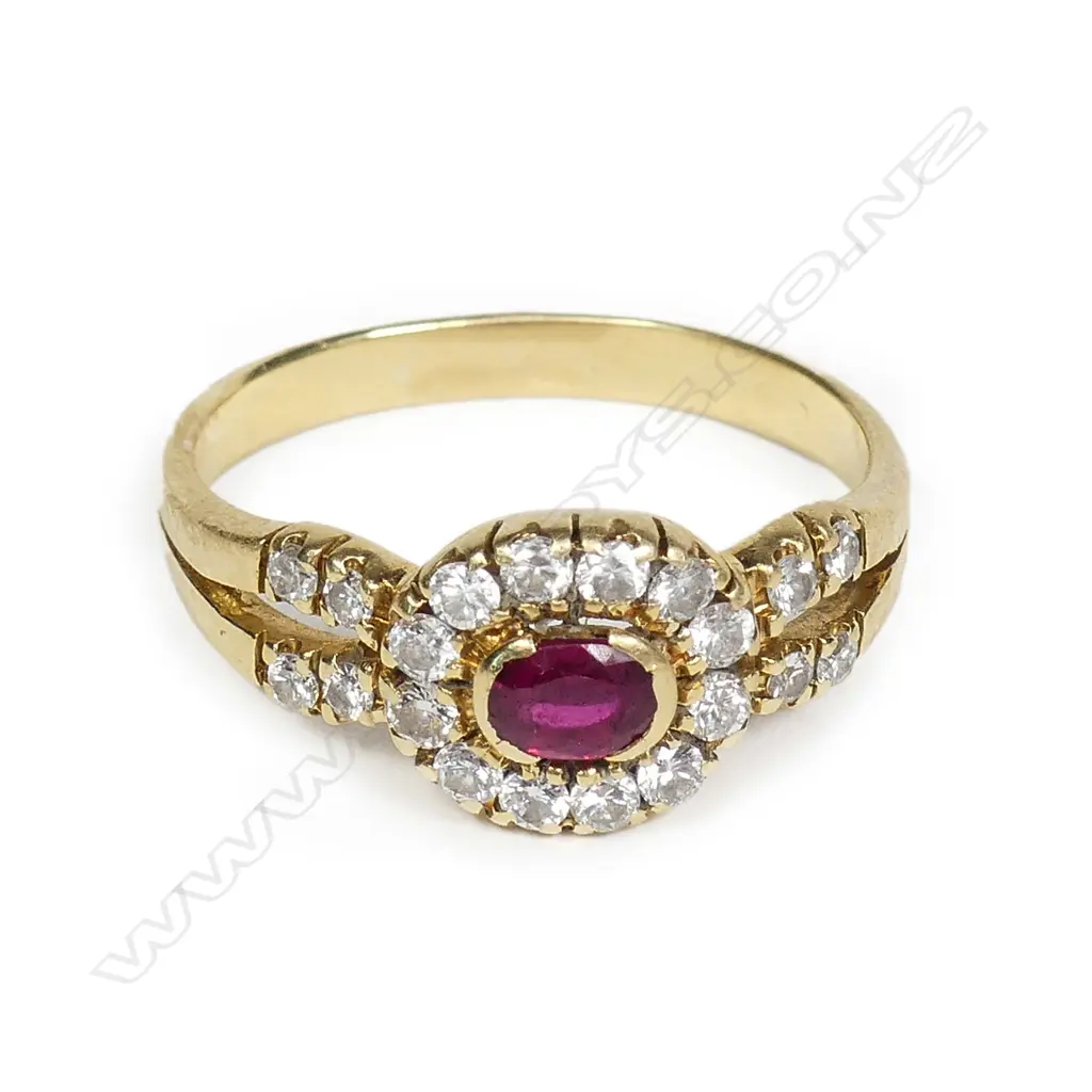 An 18ct yellow gold ruby and diamond cluster ring Image 1++