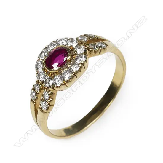 An 18ct yellow gold ruby and diamond cluster ring