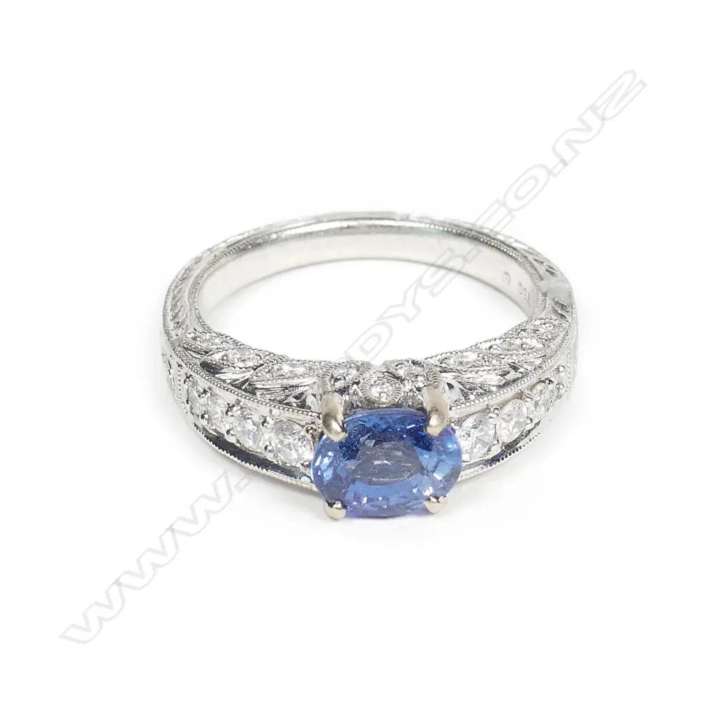 An 18ct white gold sapphire and diamond ring Image 1++