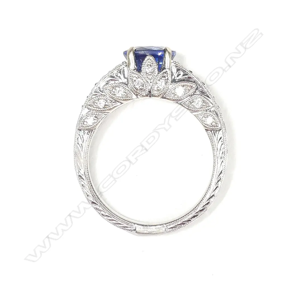An 18ct white gold sapphire and diamond ring Image 1++