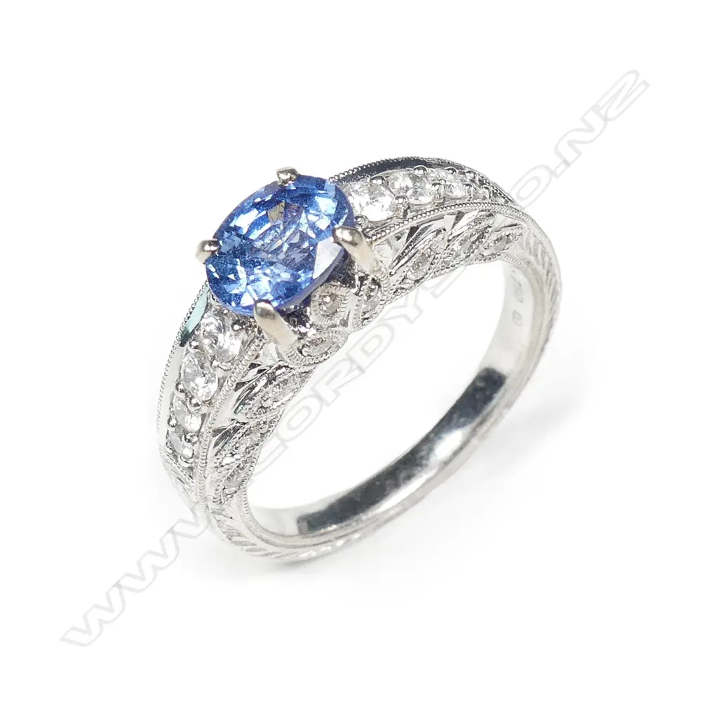 An 18ct white gold sapphire and diamond ring Image 1++