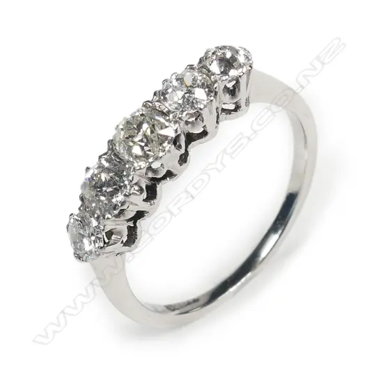 An 18ct white gold and five stone diamond ring