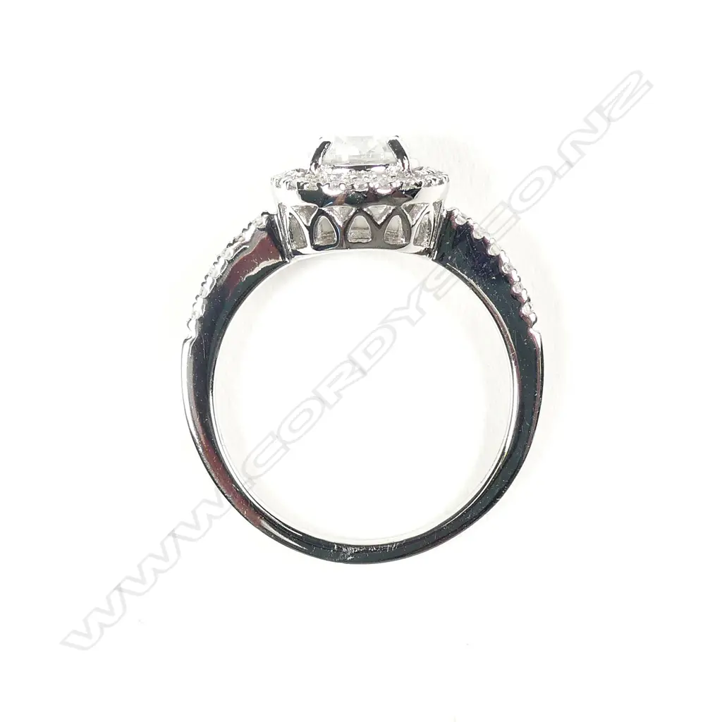 A 14ct white gold and diamond halo ring Image 1++