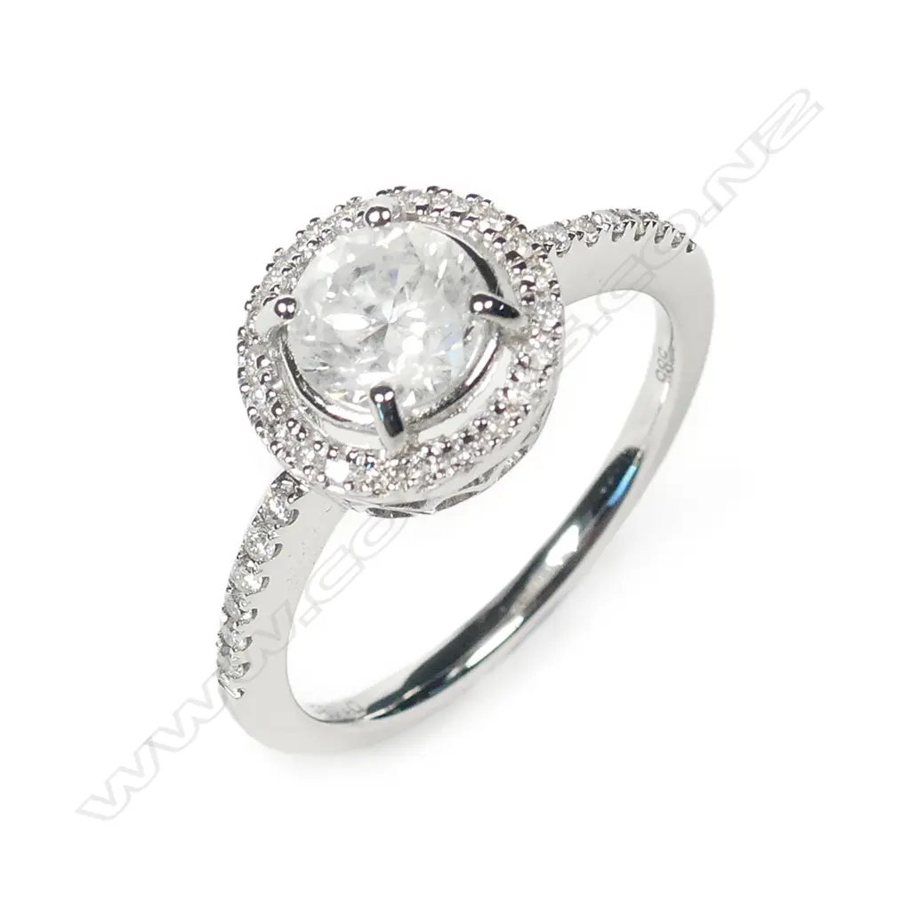 A 14ct white gold and diamond halo ring Image 1++